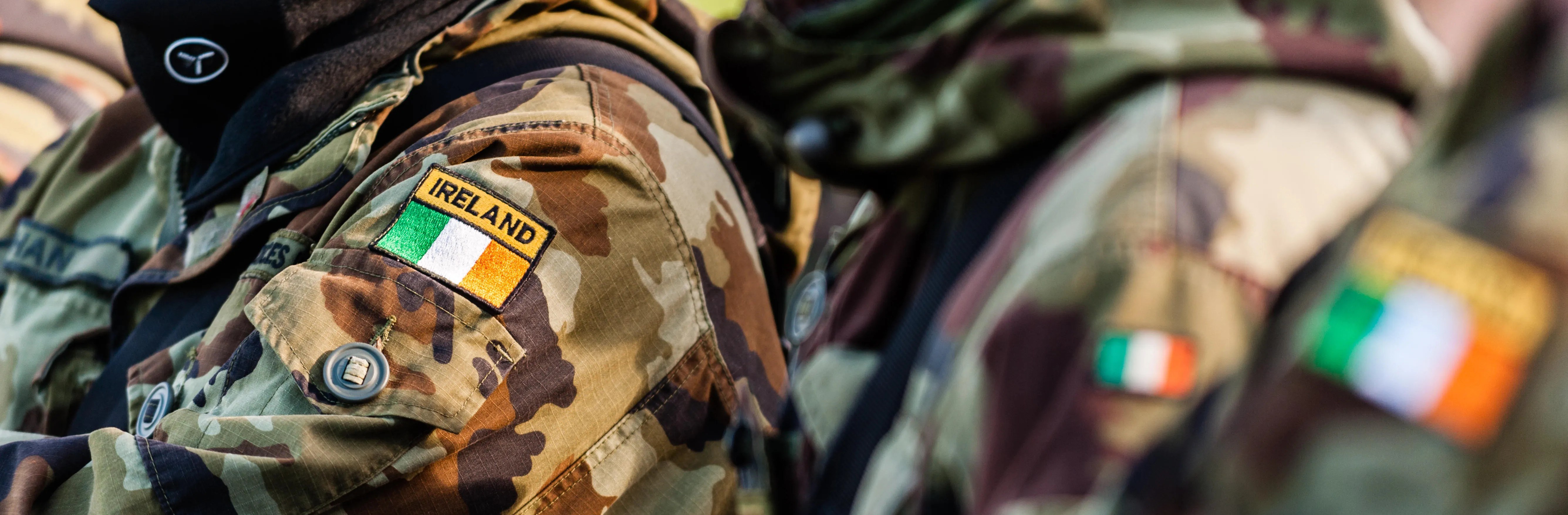 The sleeve of the Defence Forces uniform, the Ireland flag is shown on the shoulder of the uniform sewn onto the camouflage jacket 