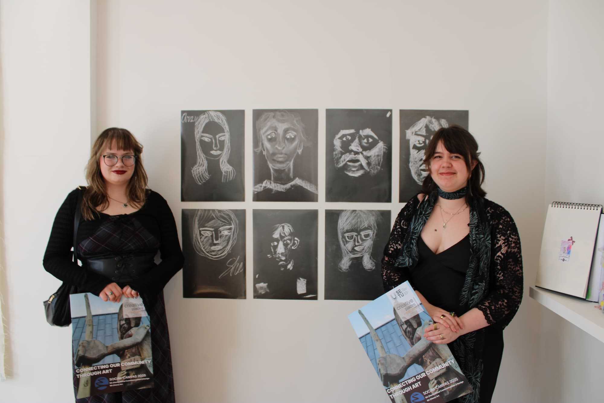 Picture of 2 Students showcasing their art work they created with the Ukrainian Community Group at Wexford Arts Centre.