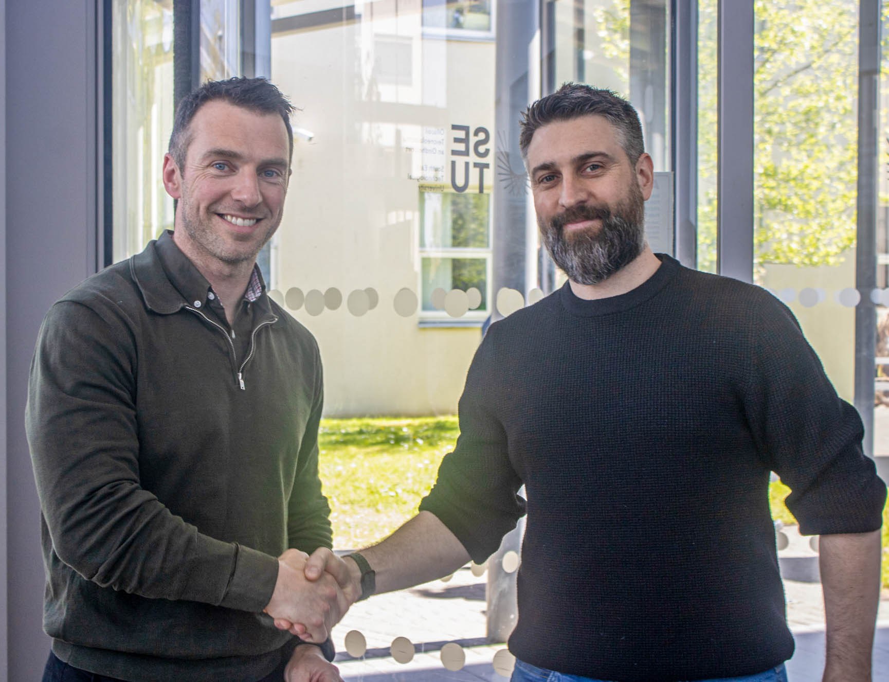 Simon Walshe, Netwatch, is pictured with an award winner at the SETU Computing Showcase.