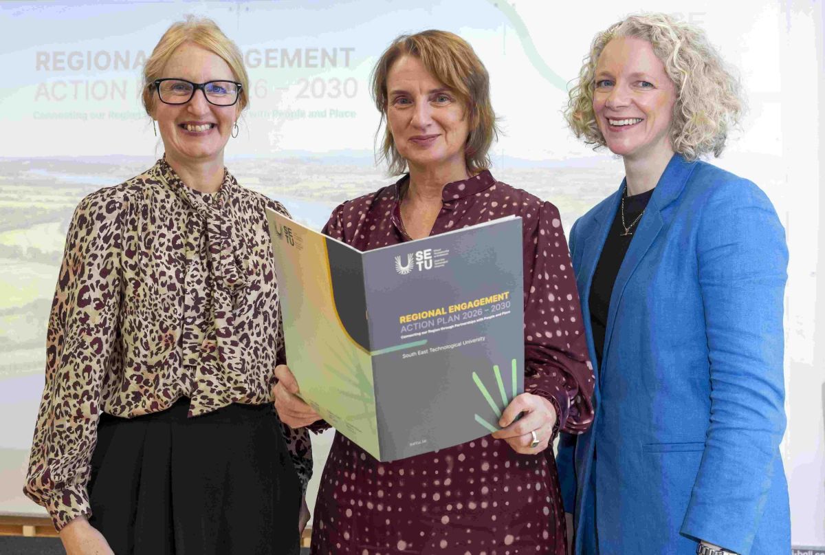 Group of three with strategy report in hand