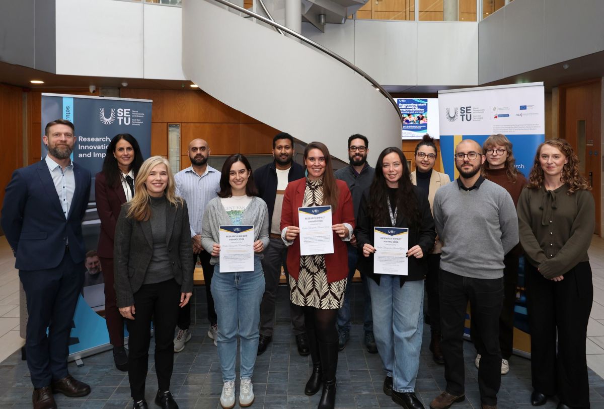 Project Team standing in front of SETU banner holding award certificates