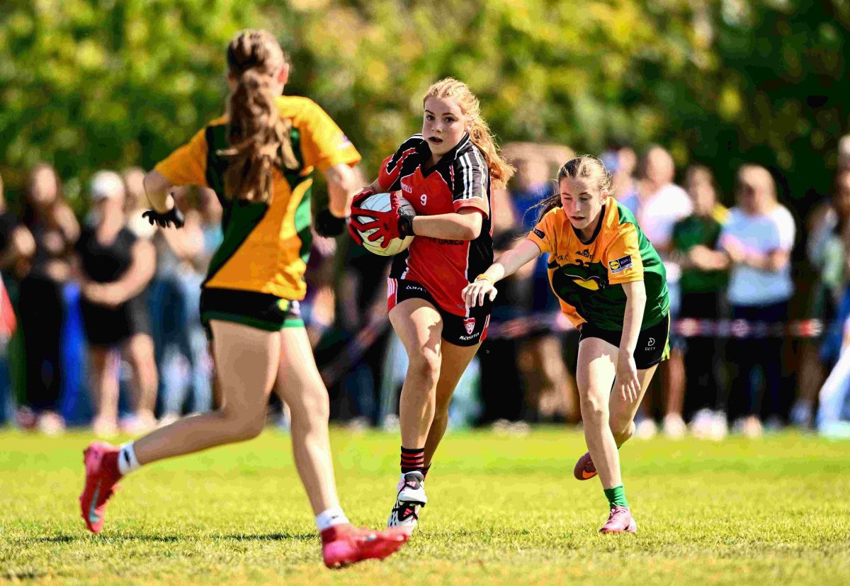 Young athletes playing football at Cairn Community Games