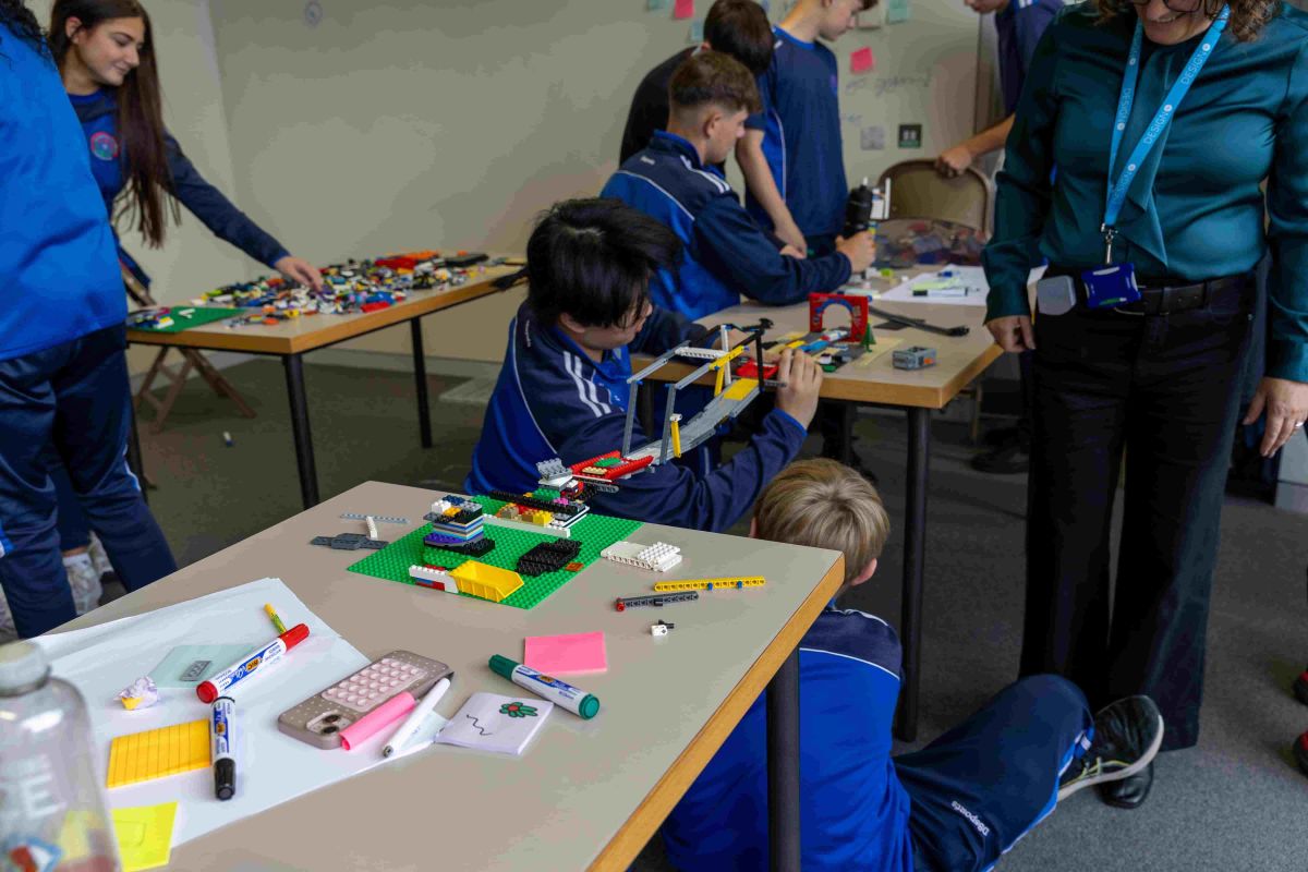 Students building a bridge using Lego