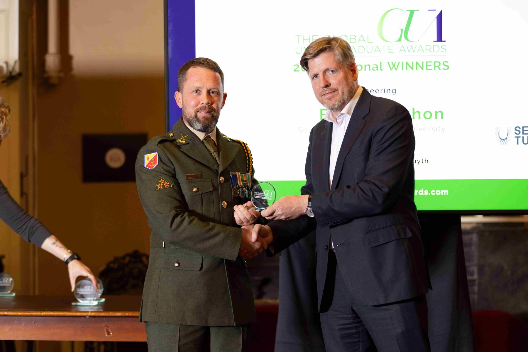 Sgmn Ben McMahon pictured with Jim Barry, Chair of the Global Undergraduate Awards