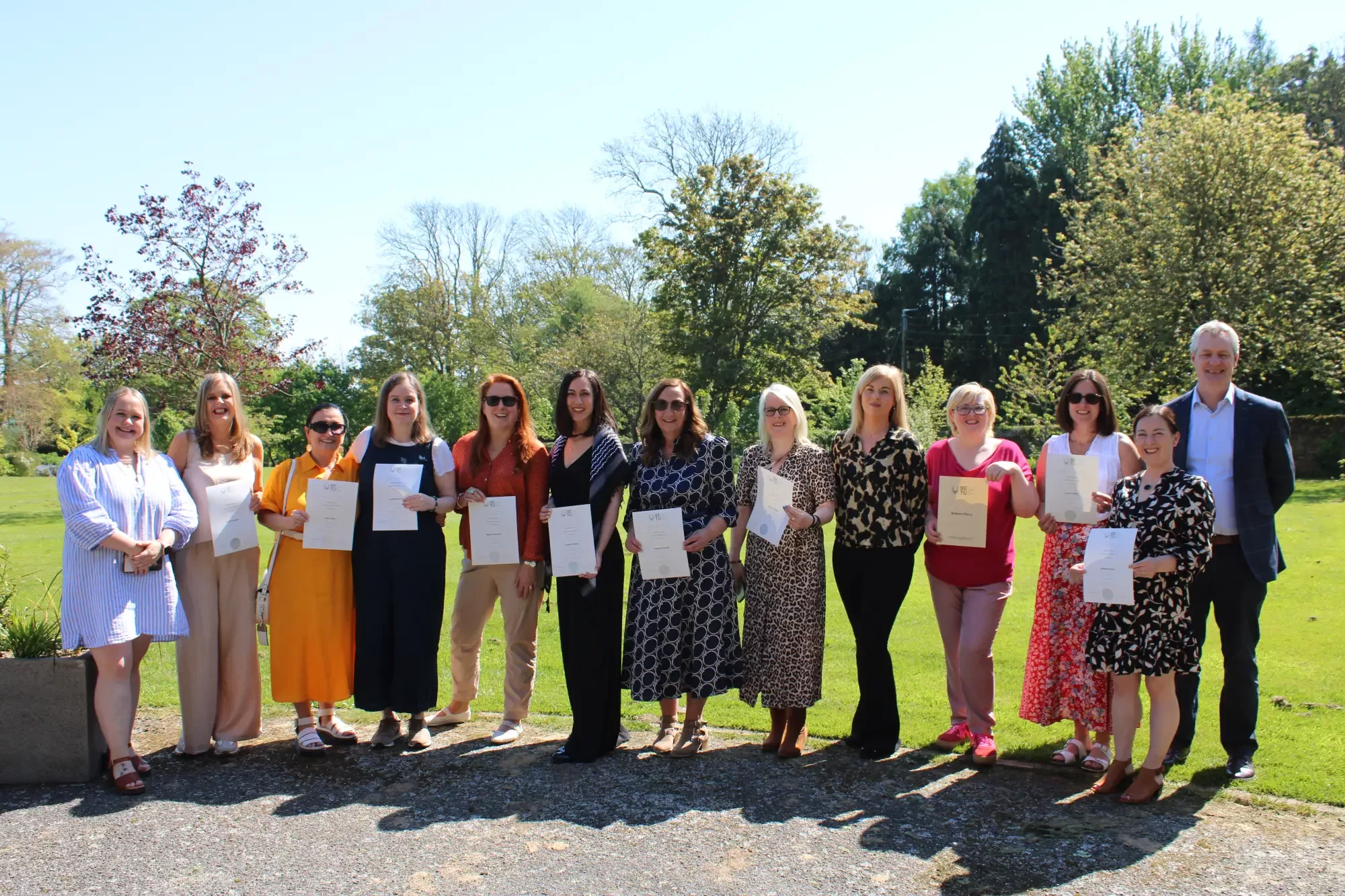 WCI staff outside with their certs.