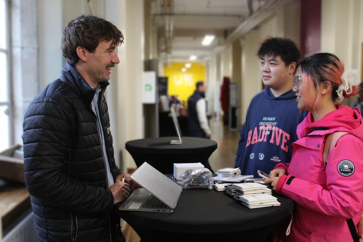 Students talking to a career representative at fair.