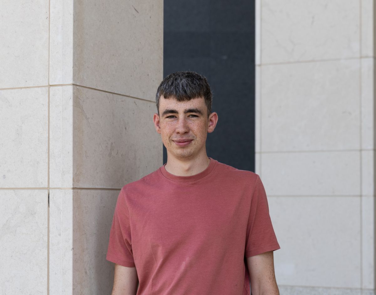 Picture of Darragh Brett standing in front of a building