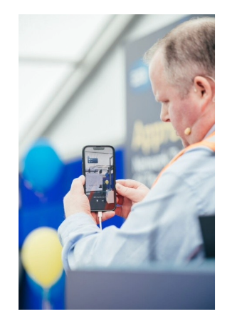 Man-with-phone-taking-picture