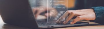 person typing on a keyboard with transparent document imagery 